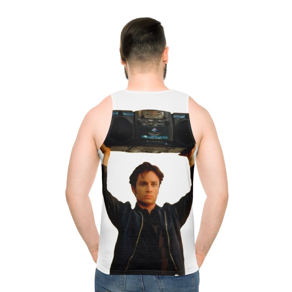 Chris Kattan holding a boombox in a 90s-inspired unisex tank top