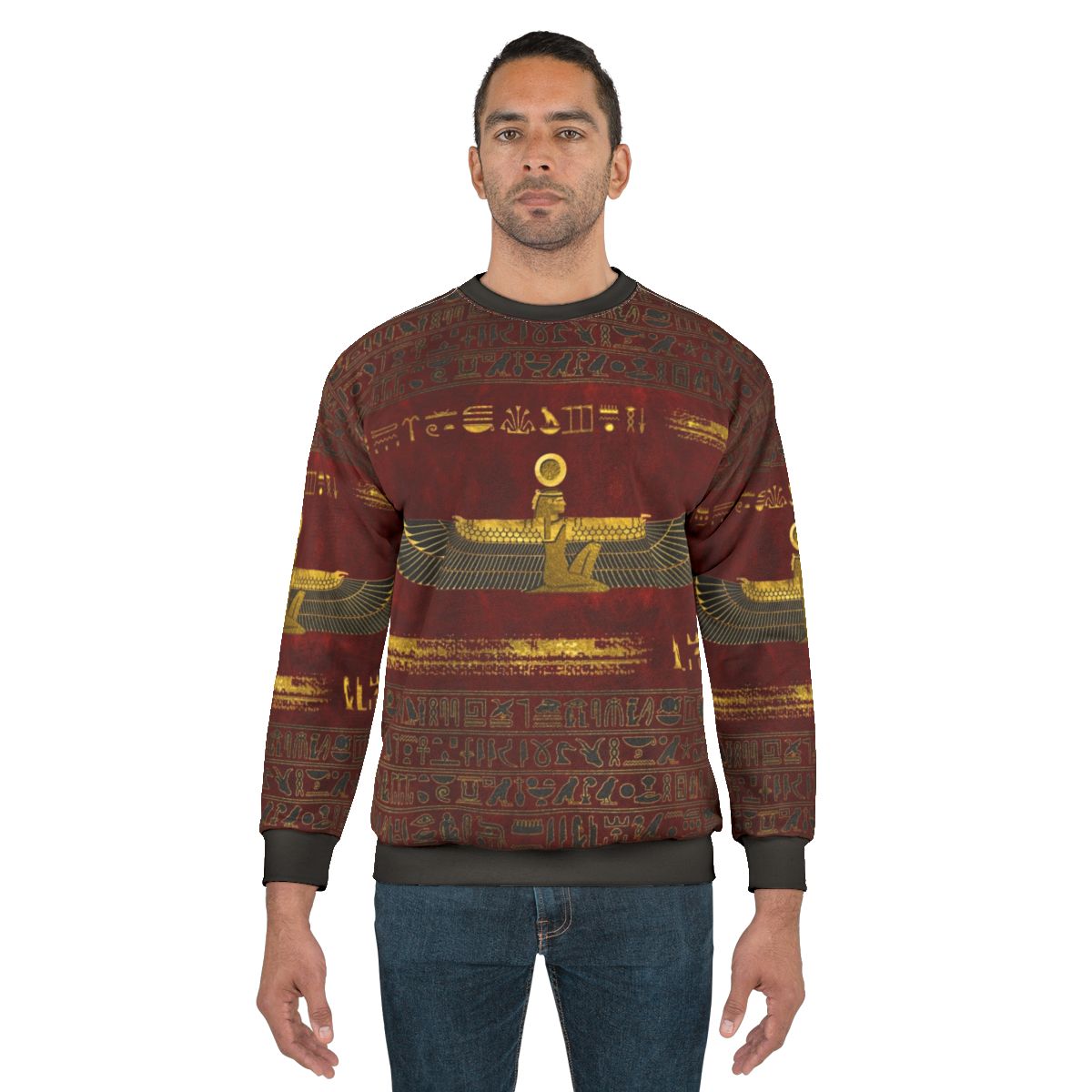 Gold Egyptian pharaoh ornament on red leather sweatshirt