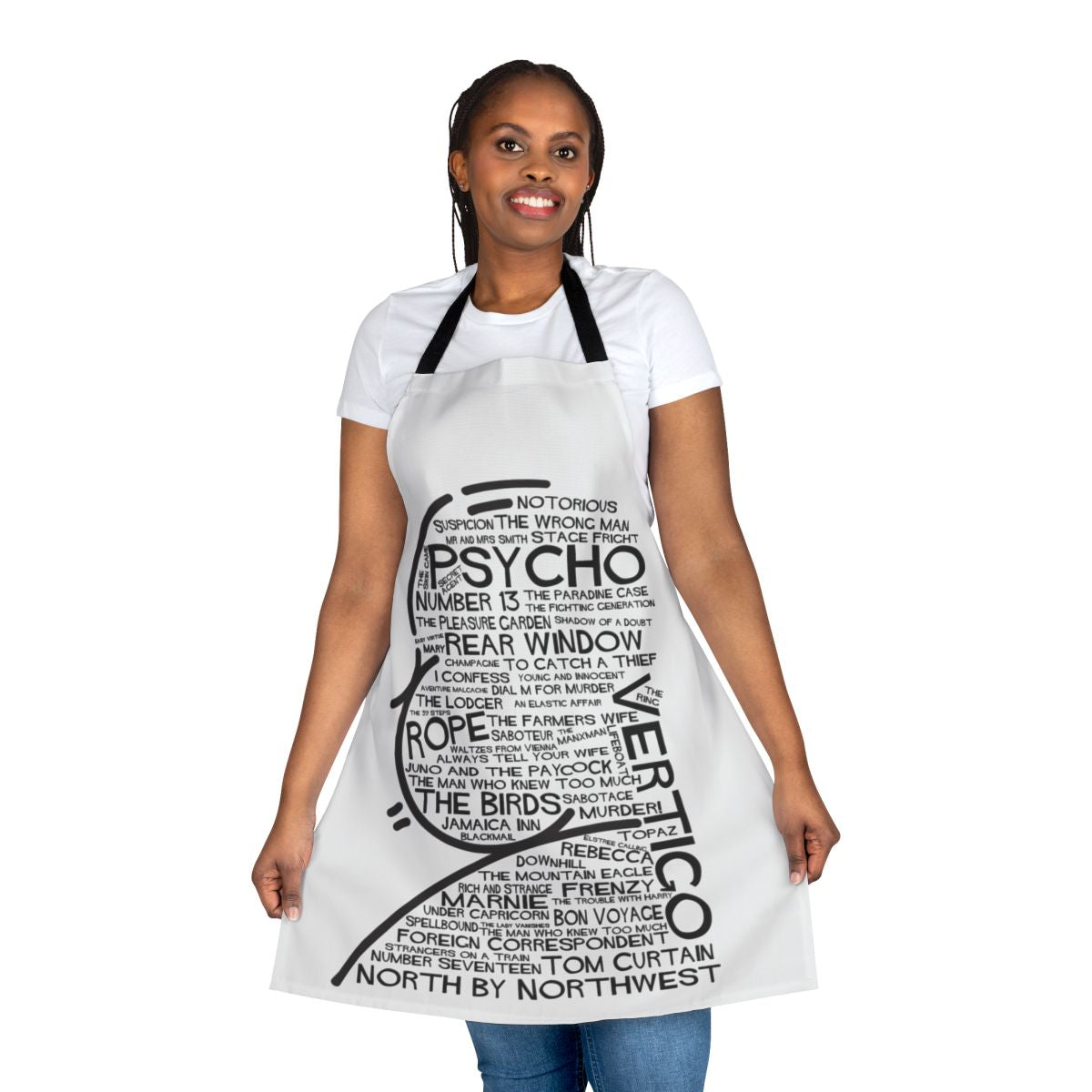 An apron featuring fan art inspired by the film titles of director Alfred Hitchcock, including Vertigo, Psycho, Rope, North by Northwest, and Number 13.