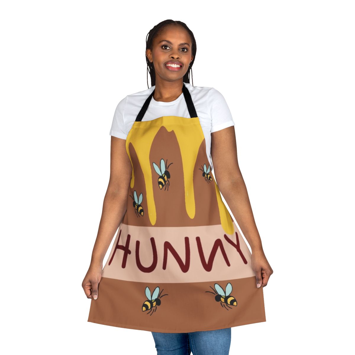 A colorful apron featuring a friendly honey bear cartoon character
