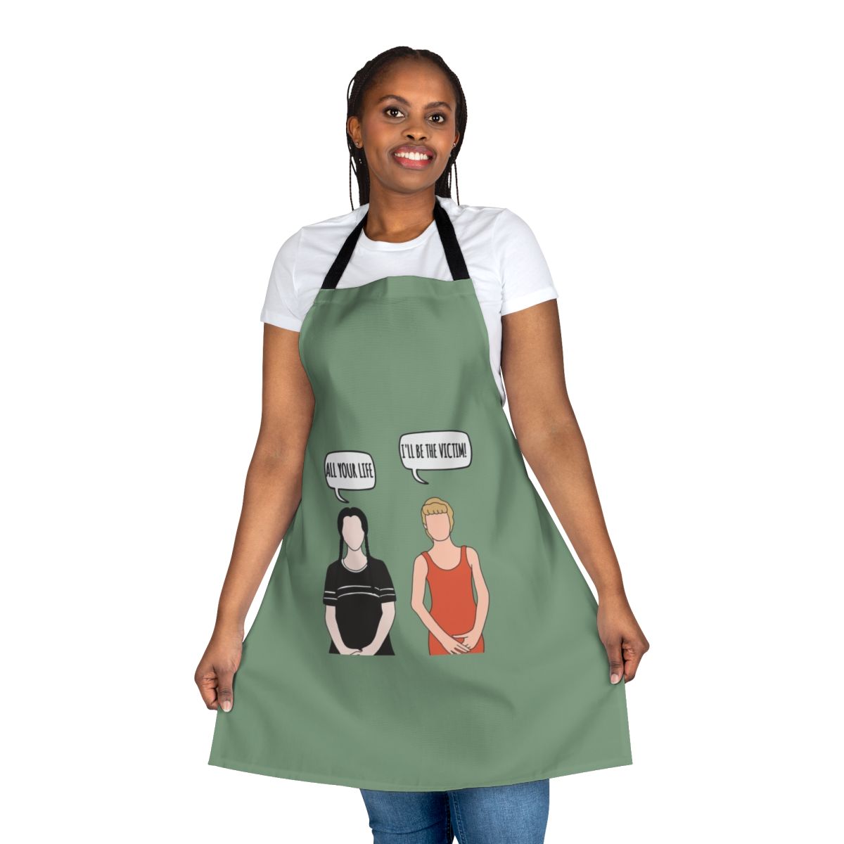 A black apron with a spooky "I'll Be the Victim" design, inspired by the Addams Family