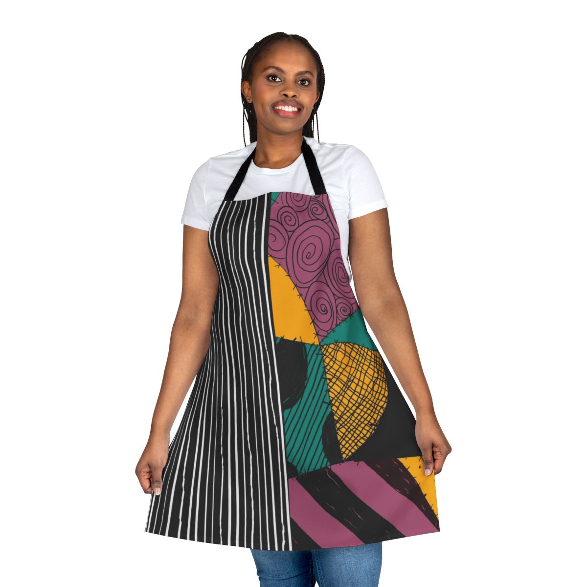 A black and white apron with Jack Skellington and Sally from The Nightmare Before Christmas design