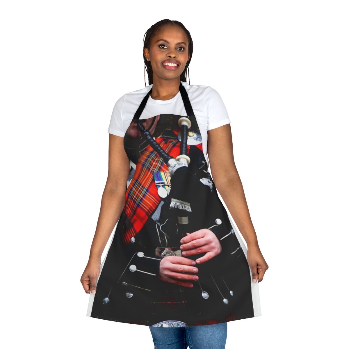 A red tartan apron with a bagpipe design, perfect for enjoying traditional Scottish music and culture.