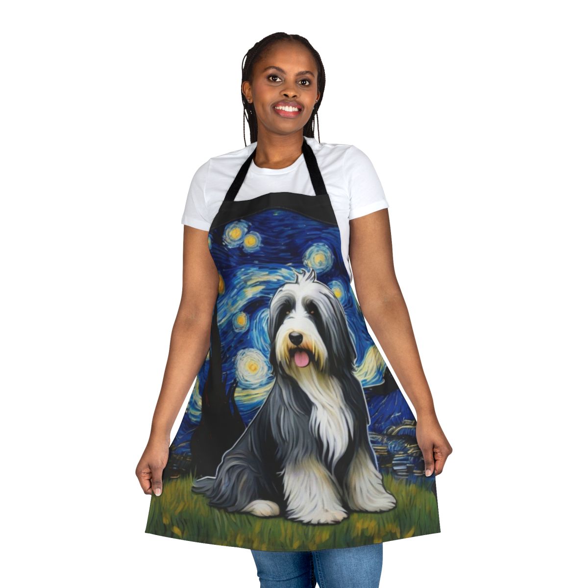 Bearded collie dog wearing a blue apron with a starry night pattern