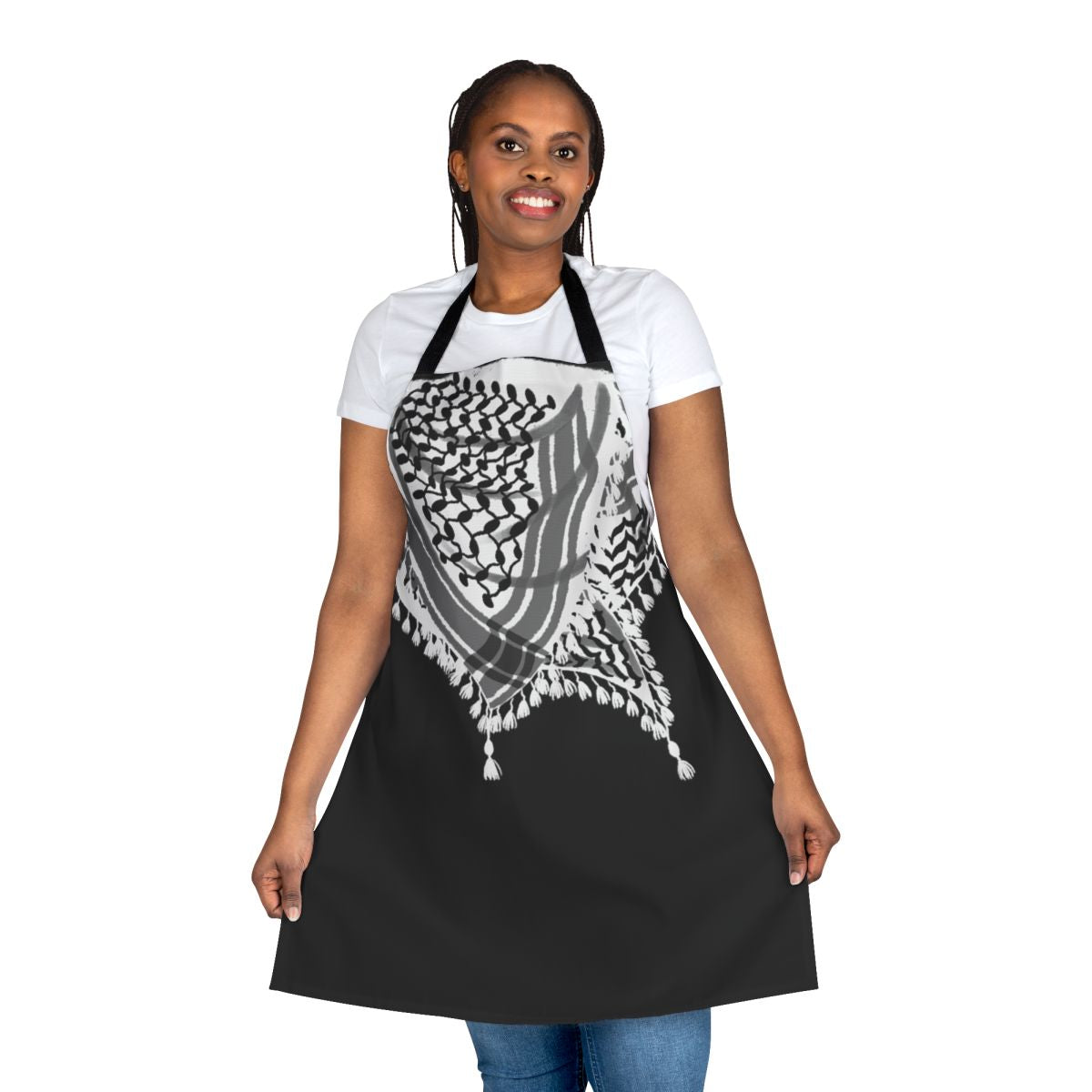 Apron featuring a keffiyeh-style neck scarf illustration in black and white with waves and tassels.