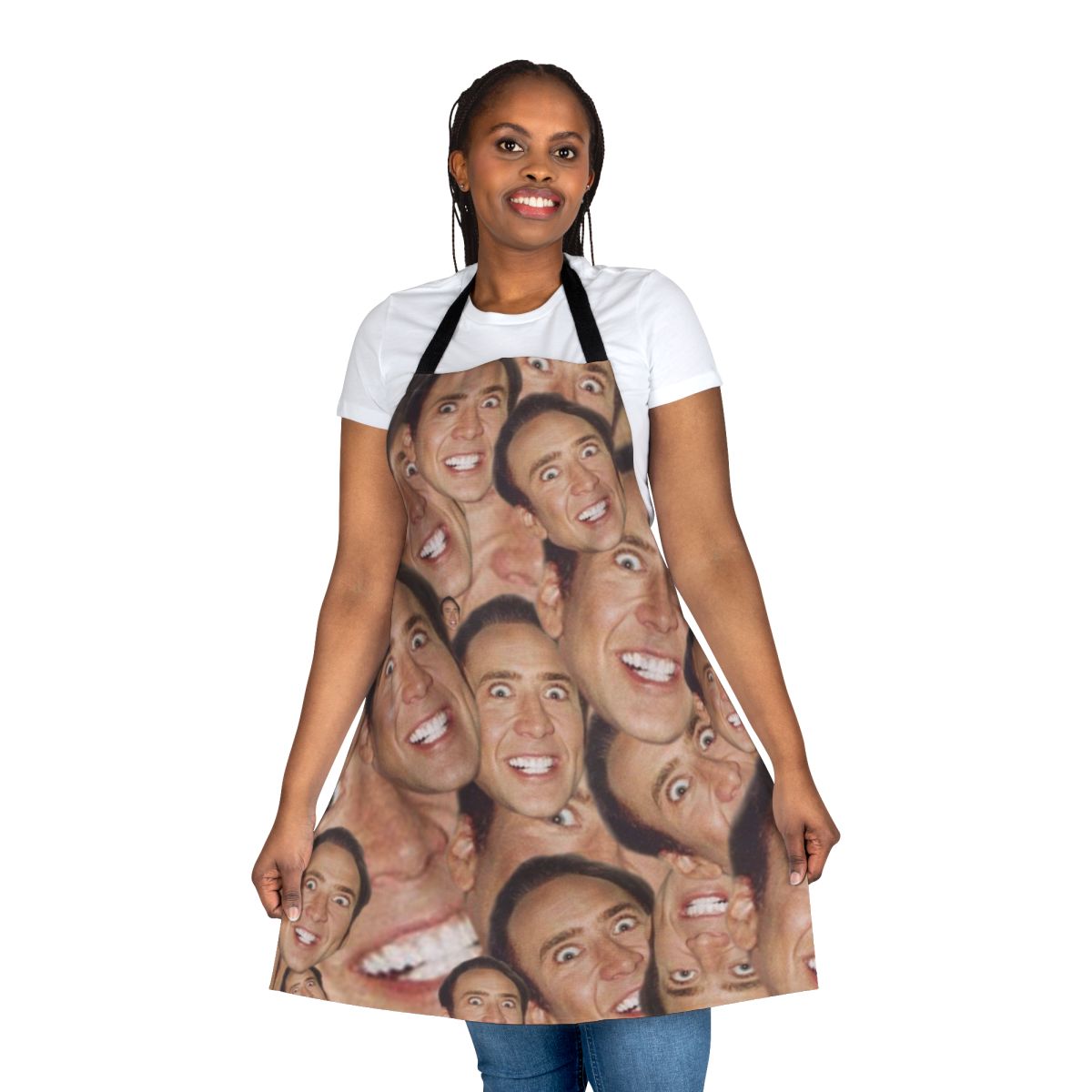 An apron featuring a collage design with the face of actor Nicolas Cage.