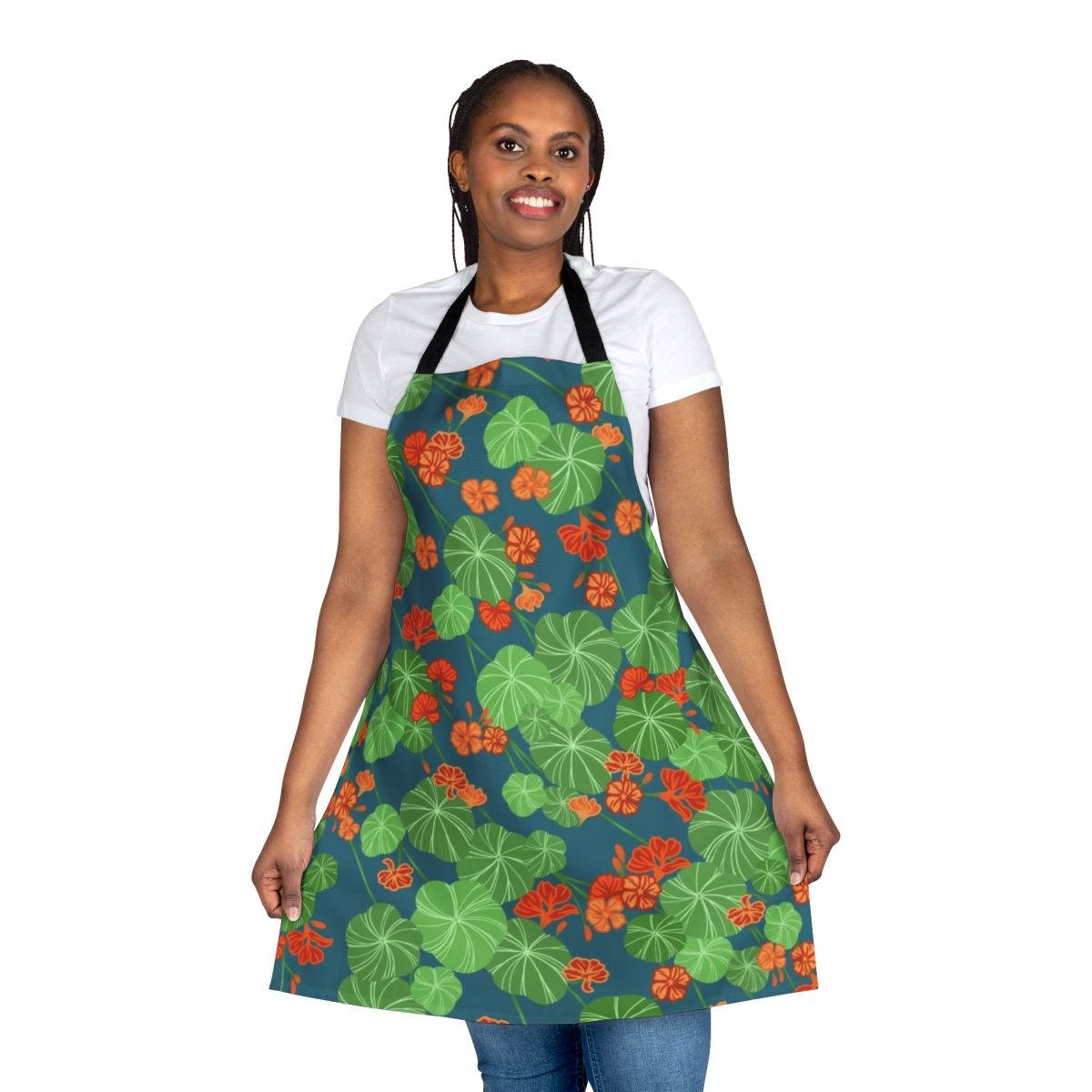 Closeup of a floral apron with a vibrant orange, green, and blue nasturtium pattern