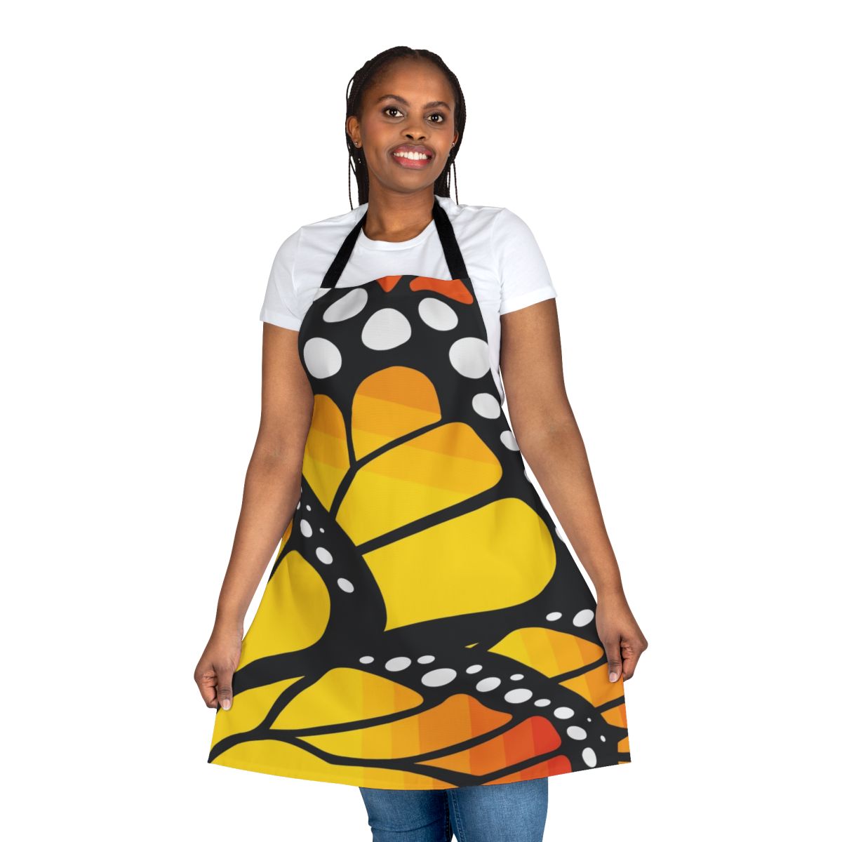 Vibrant monarch butterfly design on an orange apron with abstract and floral elements.