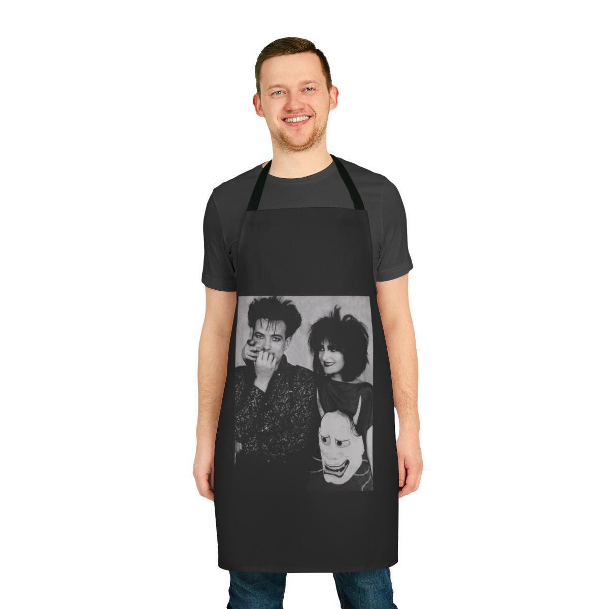 Apron featuring a stylized design with the names "Siouxsie Sioux" and "Robert Smith" against a dark background, representing 1980s alternative music.