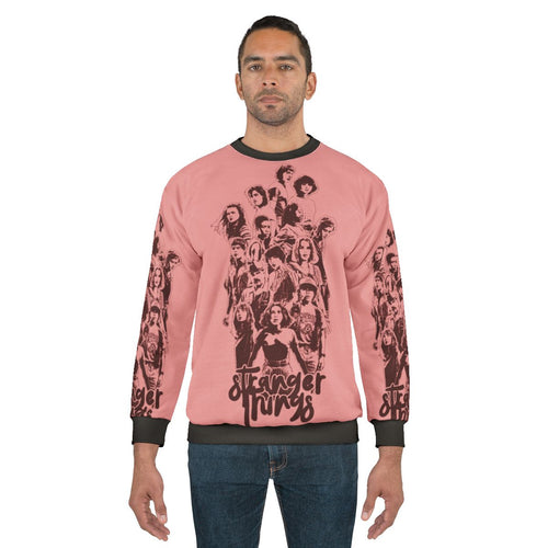 Eleven from Stranger Things wearing a 3 times stranger sweatshirt