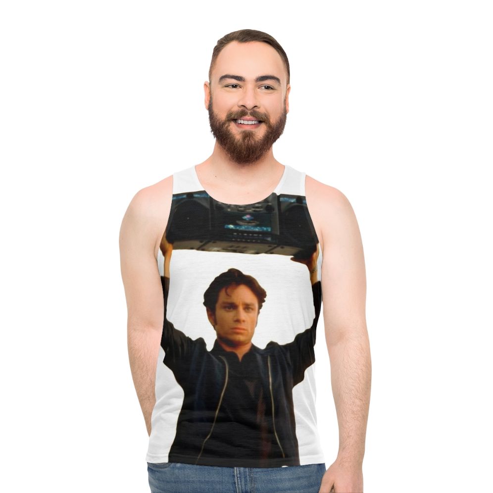Chris Kattan holding a boombox in a 90s-inspired unisex tank top