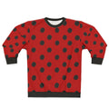 A model wearing a cozy ladybug-themed sweatshirt