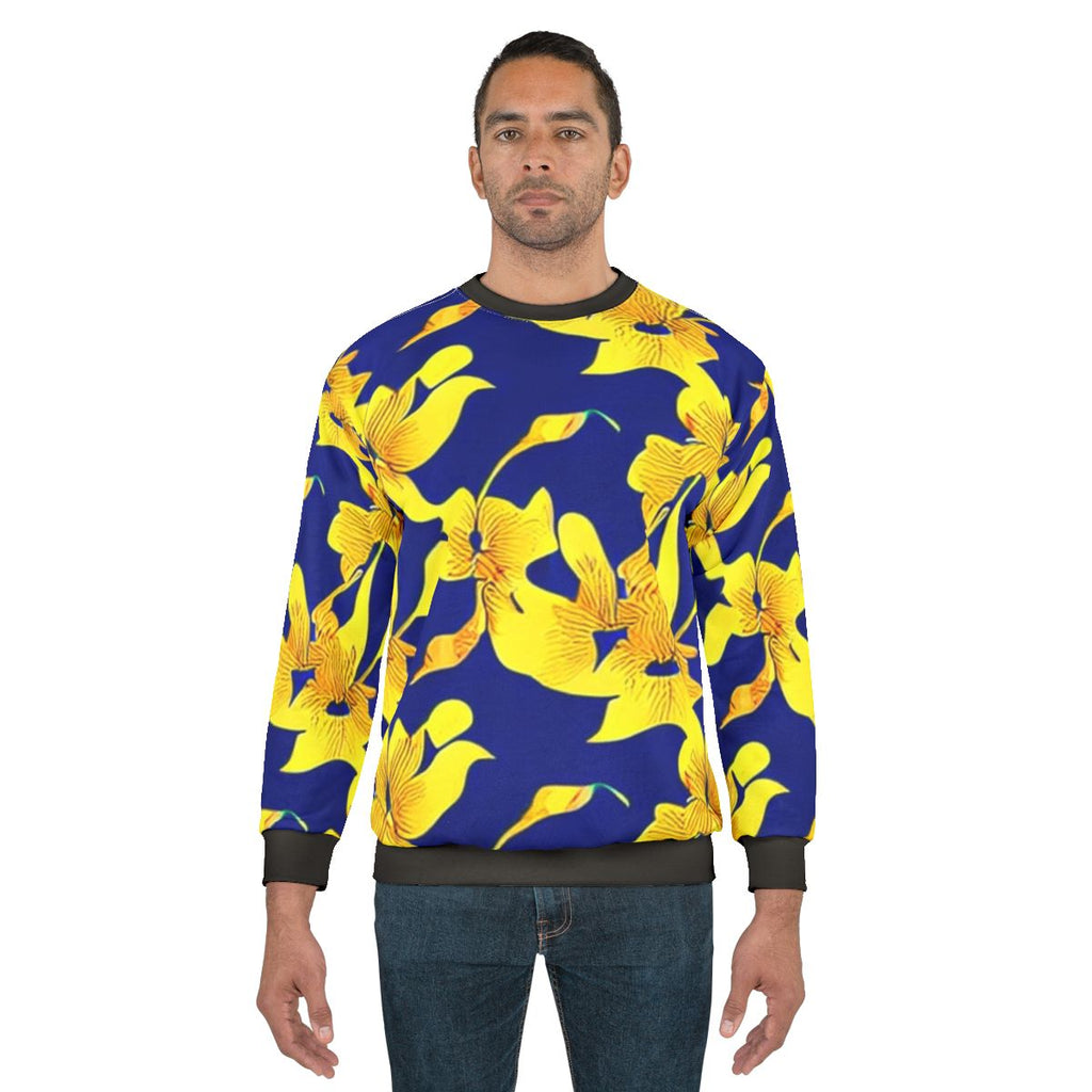 Abstract yellow floral pattern on blue sweatshirt