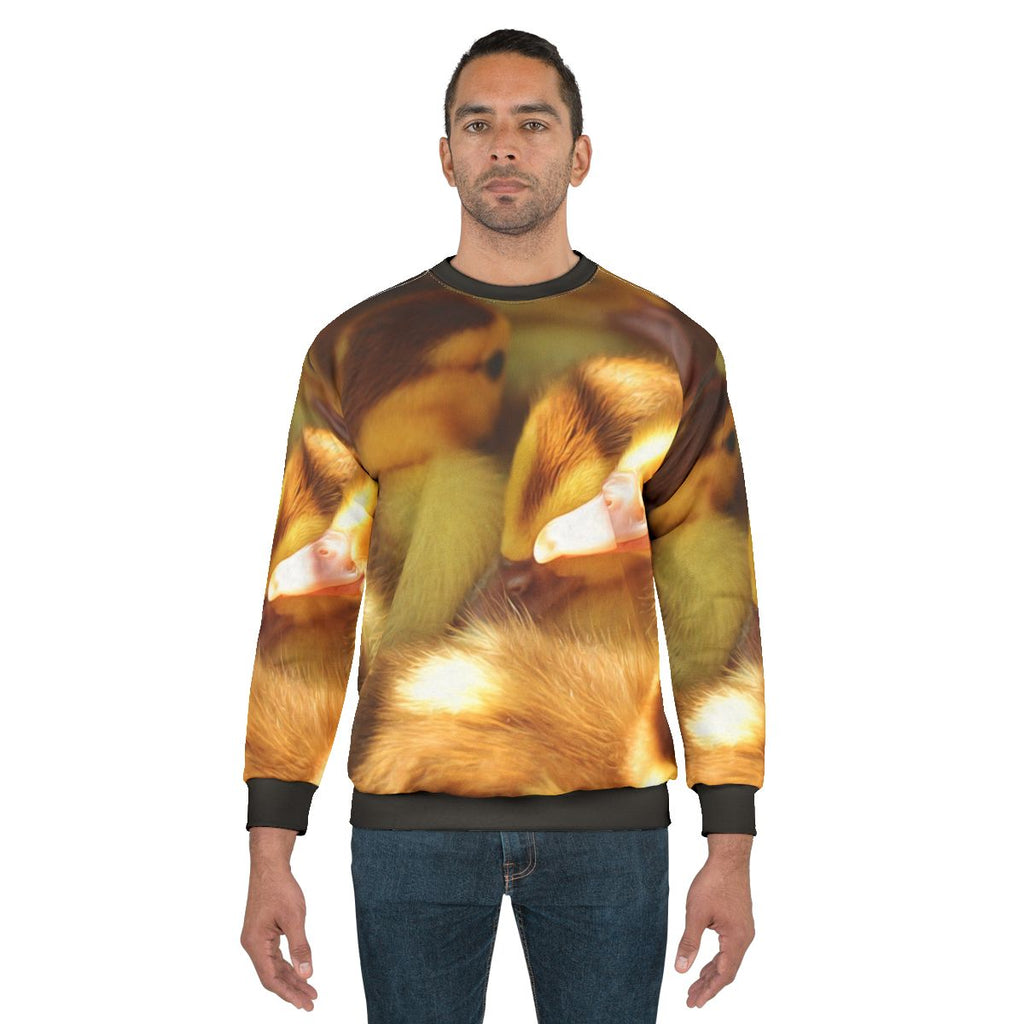 Adorable ducklings and cute fluffy ducks printed on a trendy animal sweatshirt