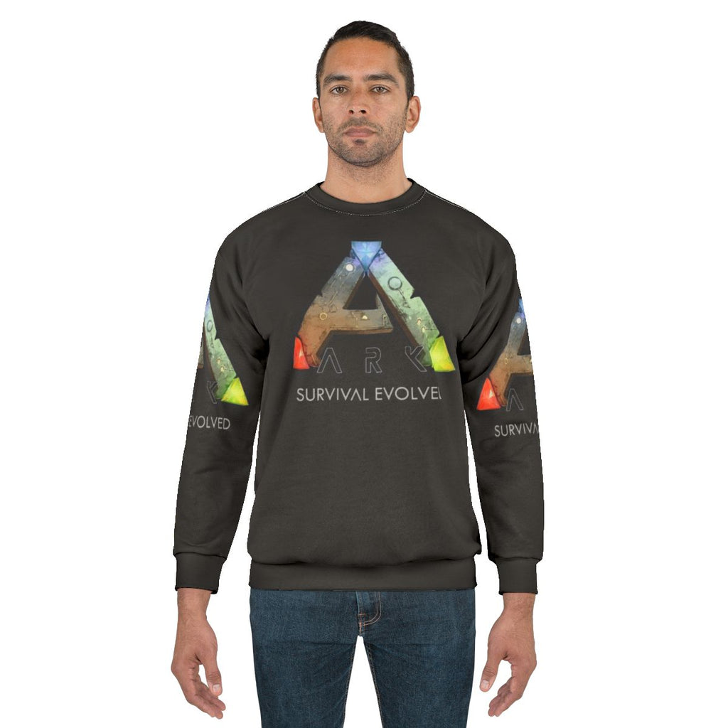 Ark Survival Evolved Sweatshirt featuring dinosaurs and video game logo