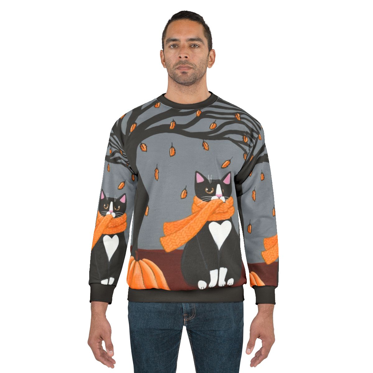 Tuxedo cat on a cozy autumn sweatshirt