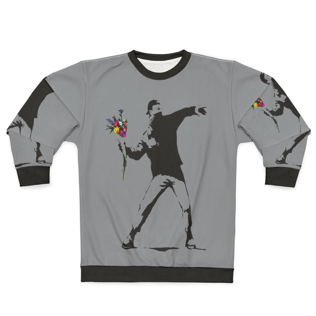 Banksy inspired sweatshirt featuring protester throwing flowers graphic