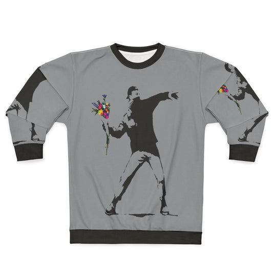 Banksy inspired sweatshirt featuring protester throwing flowers graphic