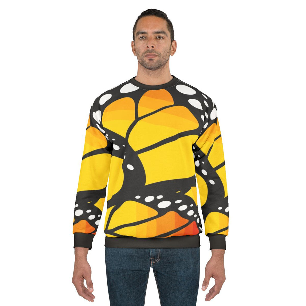 Monarch butterfly orange sweatshirt with colorful abstract pattern