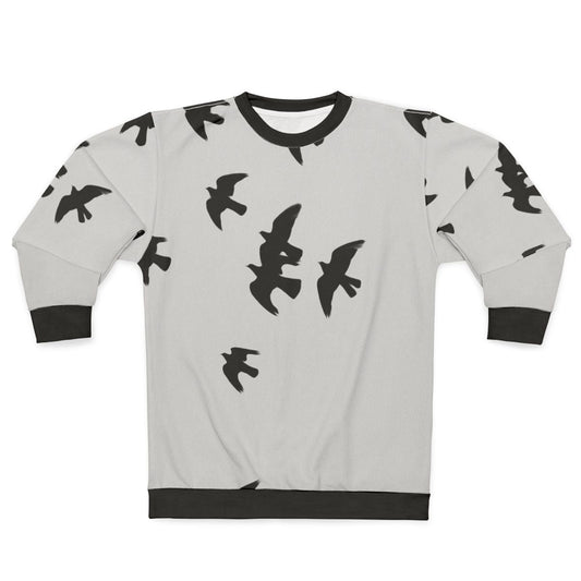 Black sweatshirt with a design of migratory birds in flight