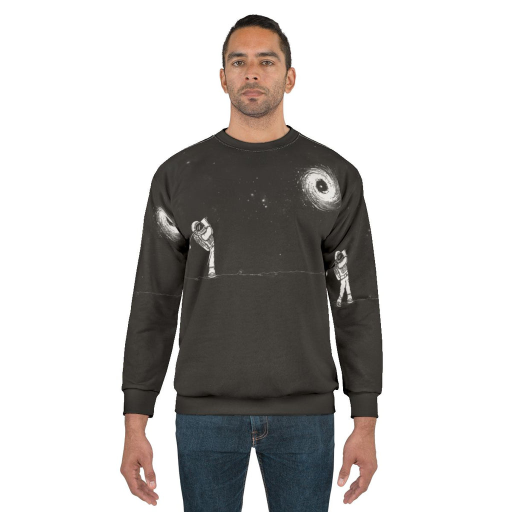 Black Hole in One Sweatshirt featuring space and golf design