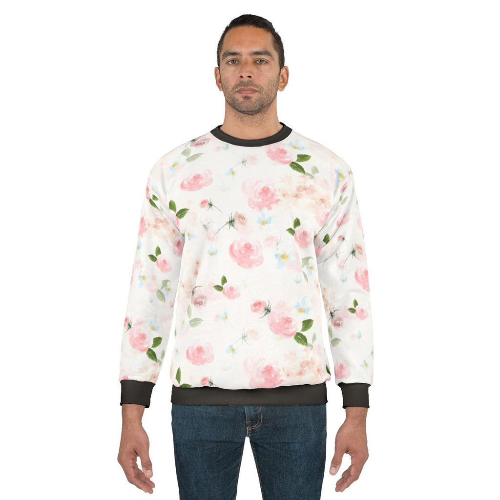 Botanical watercolor floral print on a pink sweatshirt