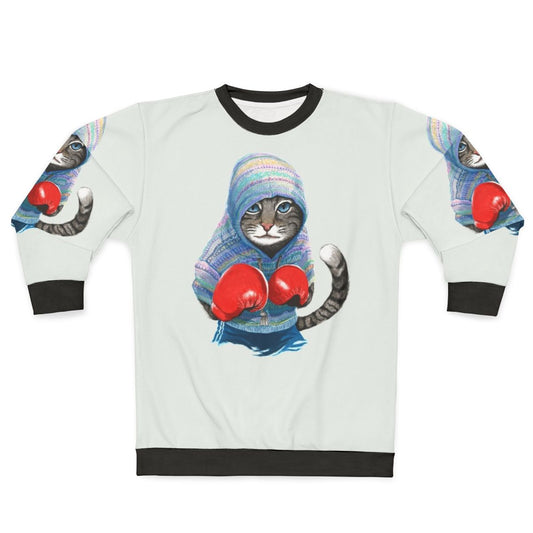 Boxing cat silhouette graphic on blue sweatshirt