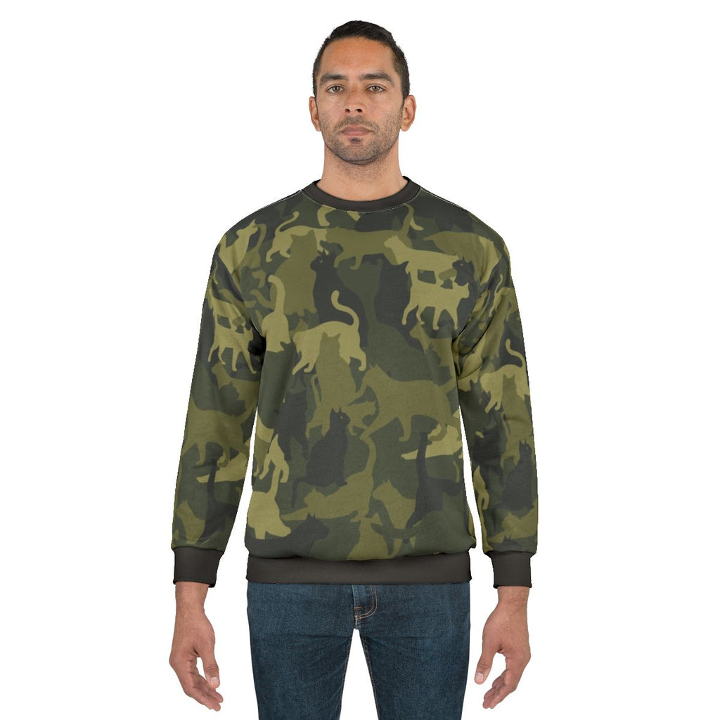 Cute cat wearing camouflage sweatshirt