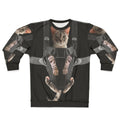 A cozy gray cat snuggled in a baby carrier on a gray sweatshirt