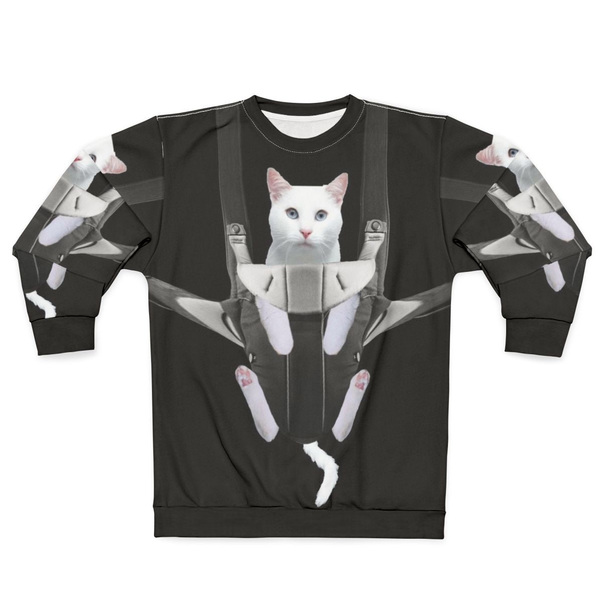 Tabby cat snuggling in a baby carrier on a white sweatshirt