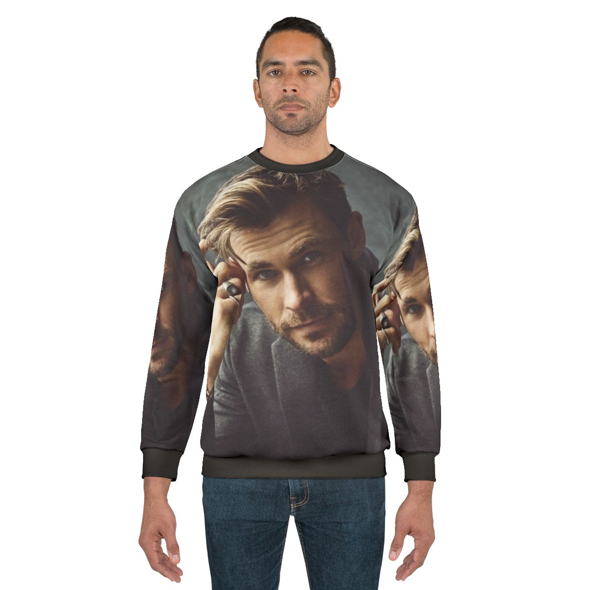 Chris Hemsworth wearing a stylish sweatshirt with the Thor logo