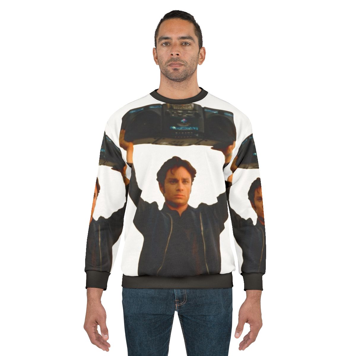 Chris Kattan holding a boombox on a retro-inspired sweatshirt