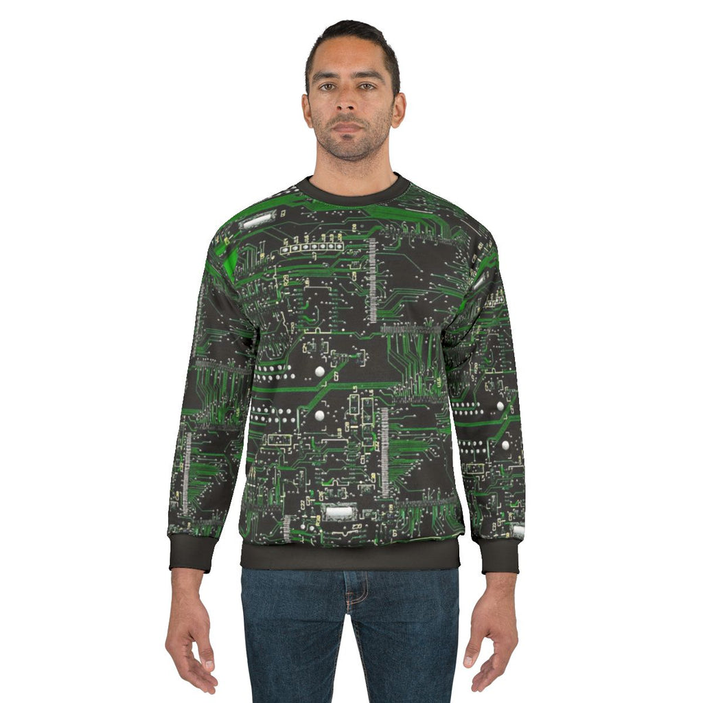Green sweatshirt with circuit board design for technology enthusiasts