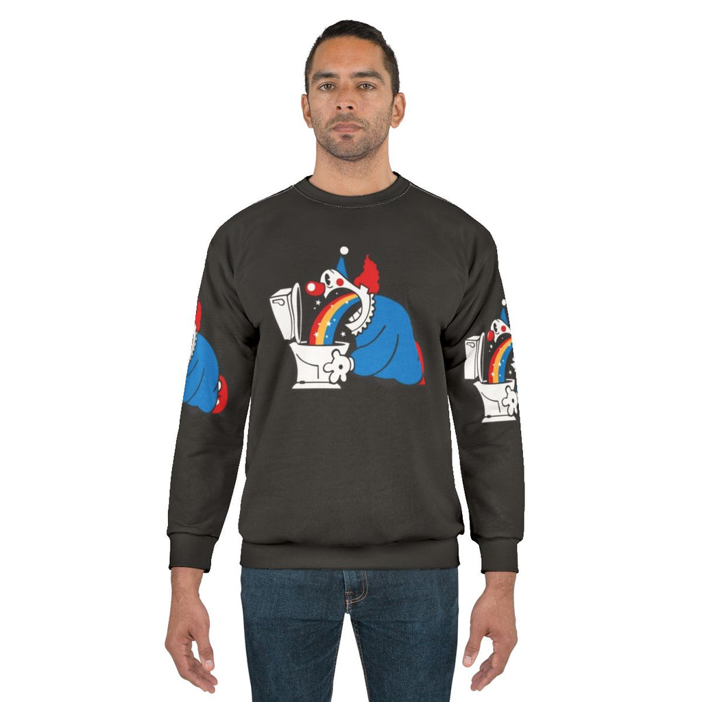 Clown puking rainbow graphic on sweatshirt