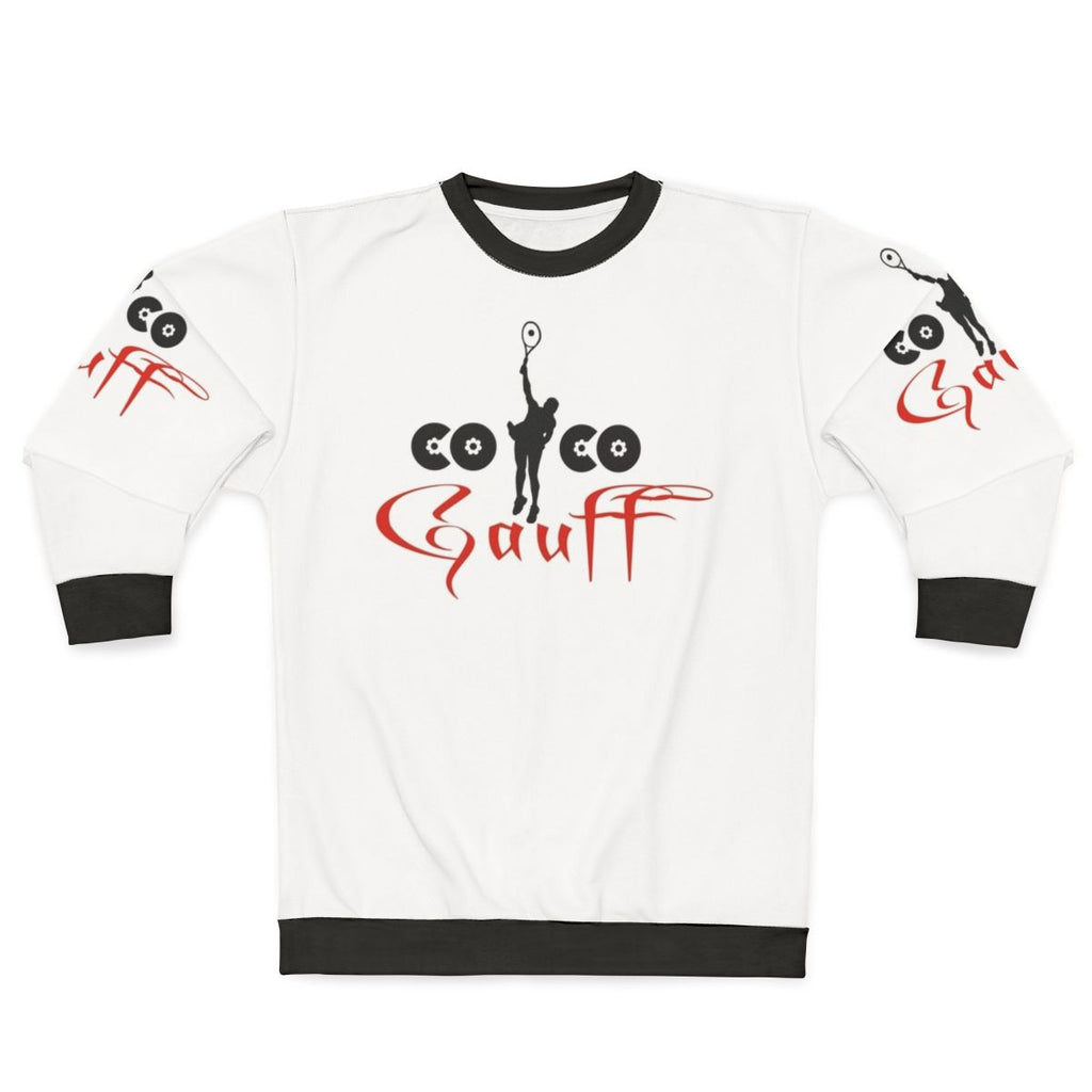 Coco Gauff wearing a white sweatshirt with her name and "Team Gauff" on it