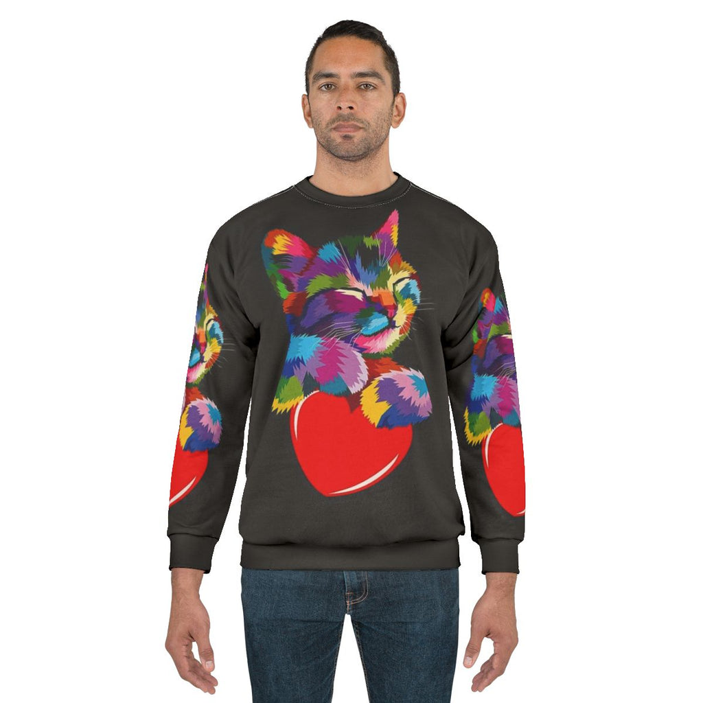Colorful cat hugging heart graphic sweatshirt