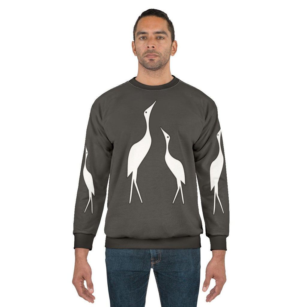 Colorful abstract sweatshirt design featuring a crane, a legendary animal, in a nature setting