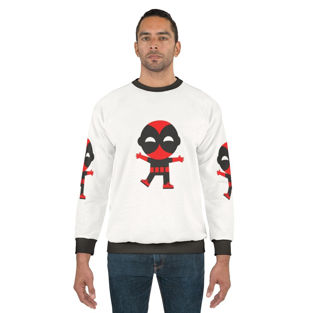 Cute baby wearing a superhero-themed sweatshirt