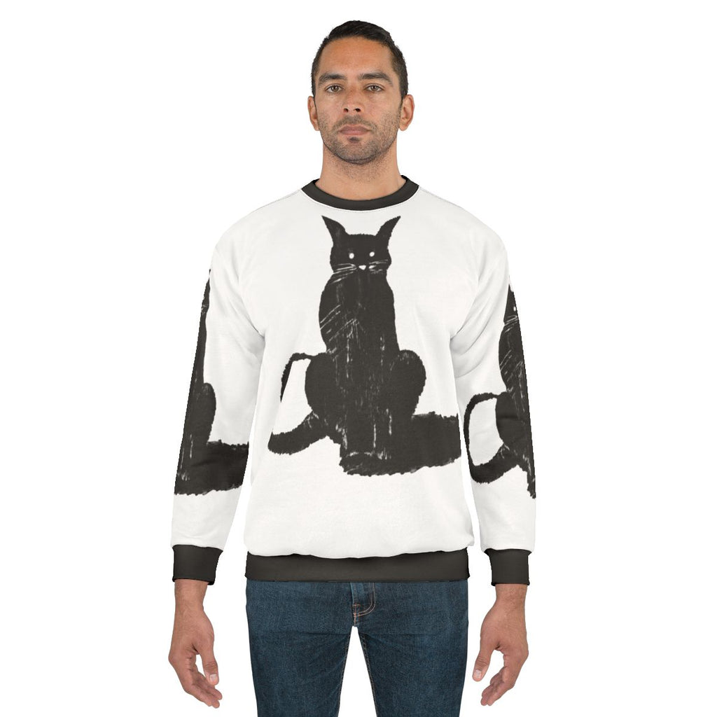Dark cat lover wearing cozy sweatshirt