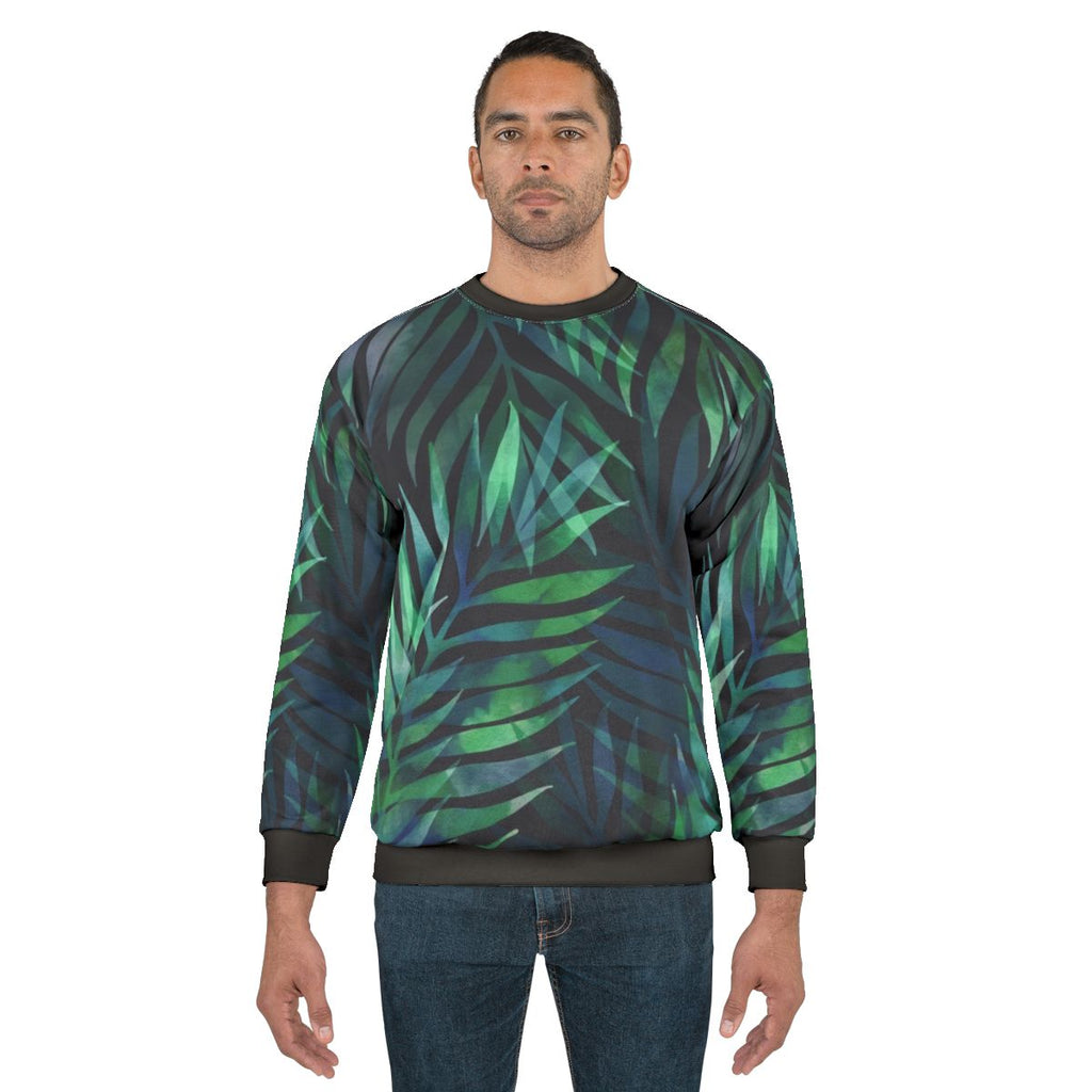 Dark green palm leaves pattern printed on a cozy sweatshirt
