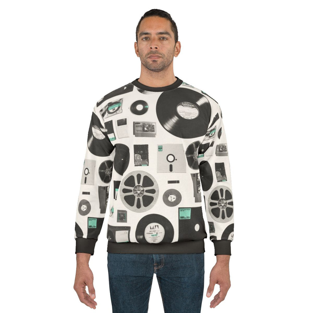 Data Sweatshirt featuring a minimalist design of vintage computer and audio media