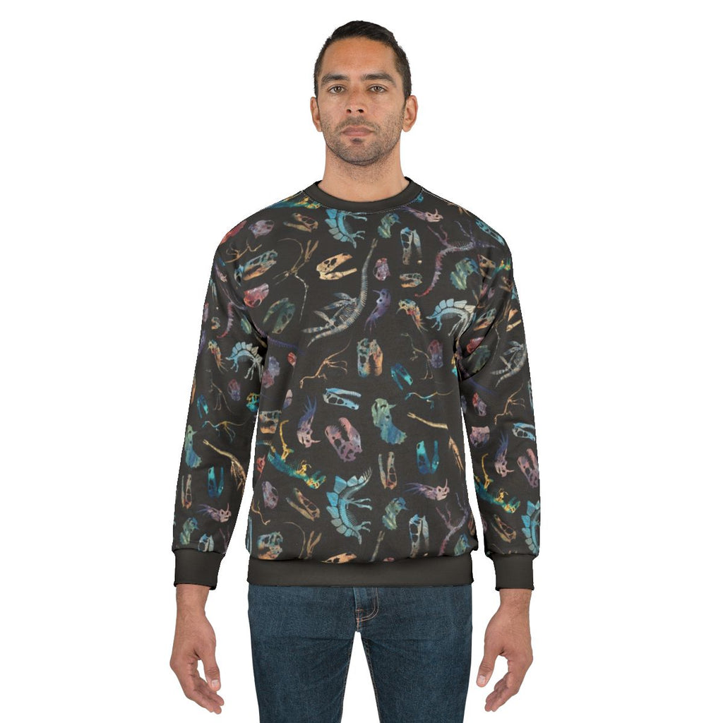 Dark sweatshirt with minimalist dinosaur fossil silhouette pattern