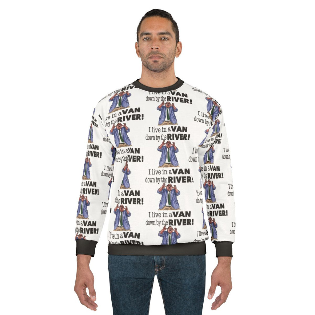 Chris Farley as Matt Foley wearing a "Down By The River" sweatshirt