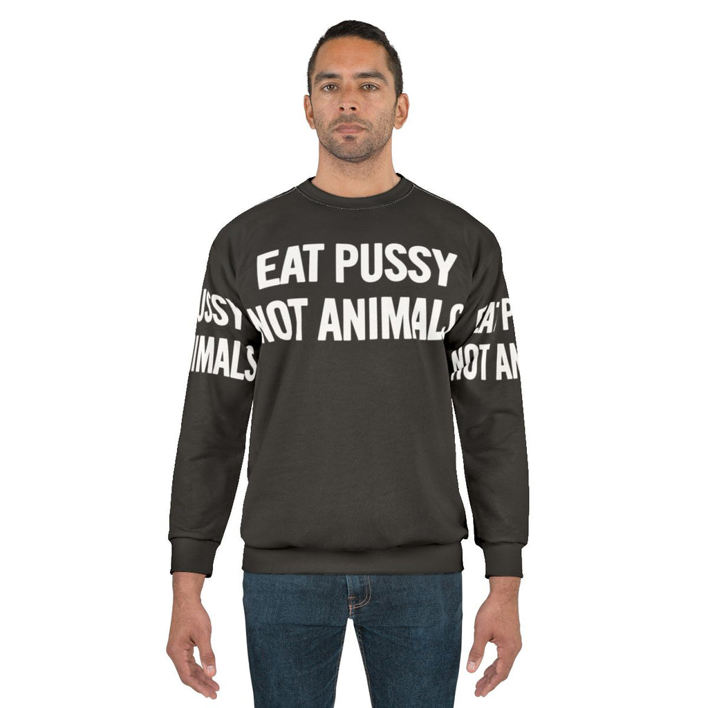 Vegan sweatshirt with "Eat Pussy Not Animals" text