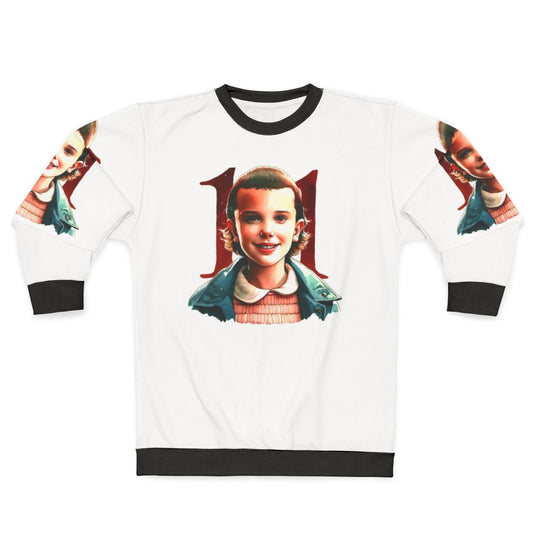 Eleven from Stranger Things wearing the official Eleven Stranger Things Sweatshirt