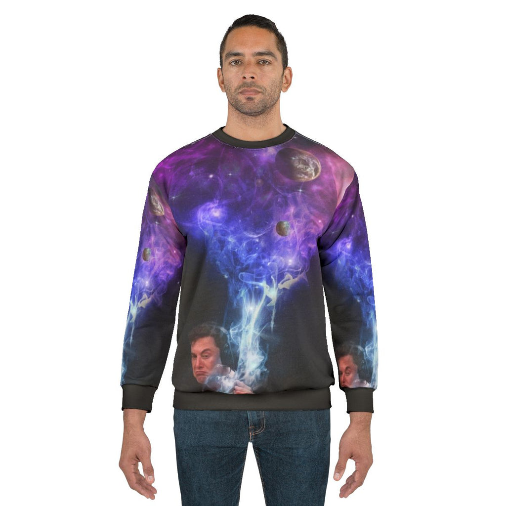 Elon Musk smoking in the cosmos sweatshirt