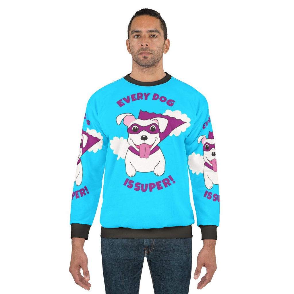 Superhero dog in a white costume with cape on a sweatshirt