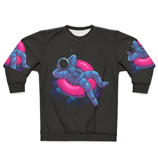 Floating Dream Sweatshirt featuring an astronaut floating in space amidst a colorful nebula