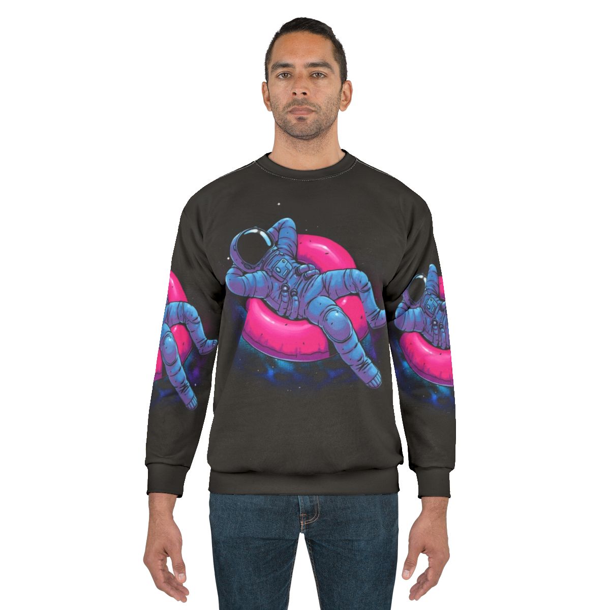Floating Dream Sweatshirt featuring an astronaut floating in space amidst a colorful nebula