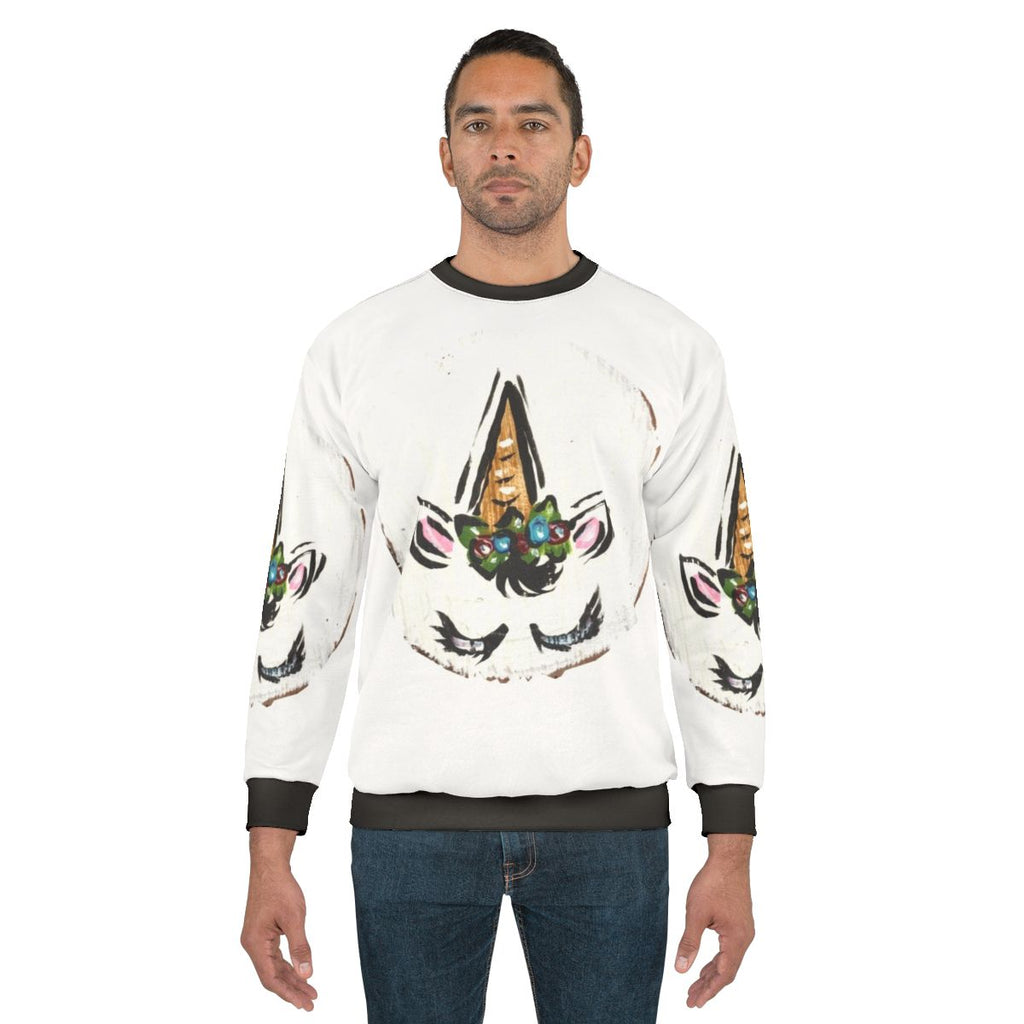 Floral unicorn sweatshirt with spiraling horn and botanical design